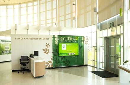 Reception area with desk and welcome screen